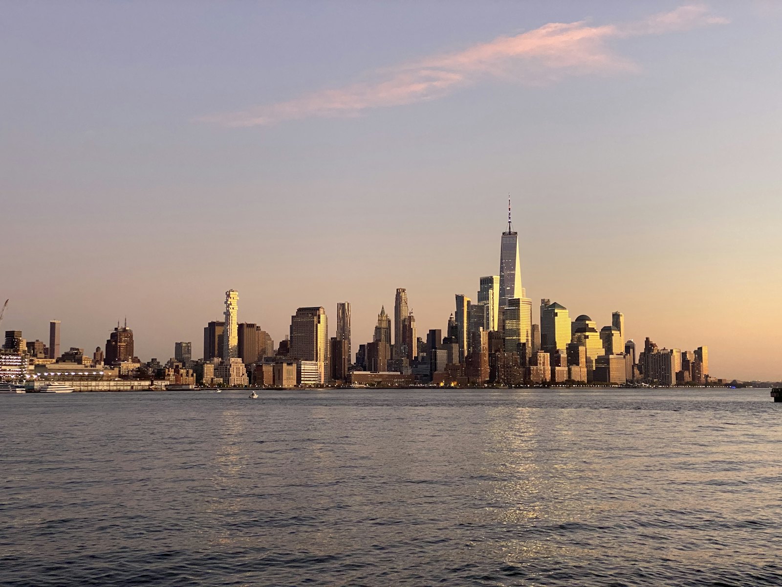 Lower Manhattan skyline seen across the Hudson at sunset